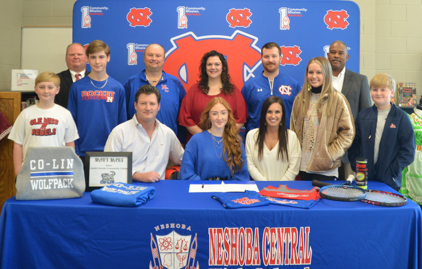 Pictured are, seated, Alex Mars, Maddox Mars, her father, Adam Mars, Mary Mars, Brooke Cook, Riley Knight and Jax Mars (Back row) Assistant Principal, Brent Pouncey, Principal Jason Gentry, Head Coach Allison Cook, Assistant Principal Jonathan Walker, and Assistant Principal LaShon Horne.